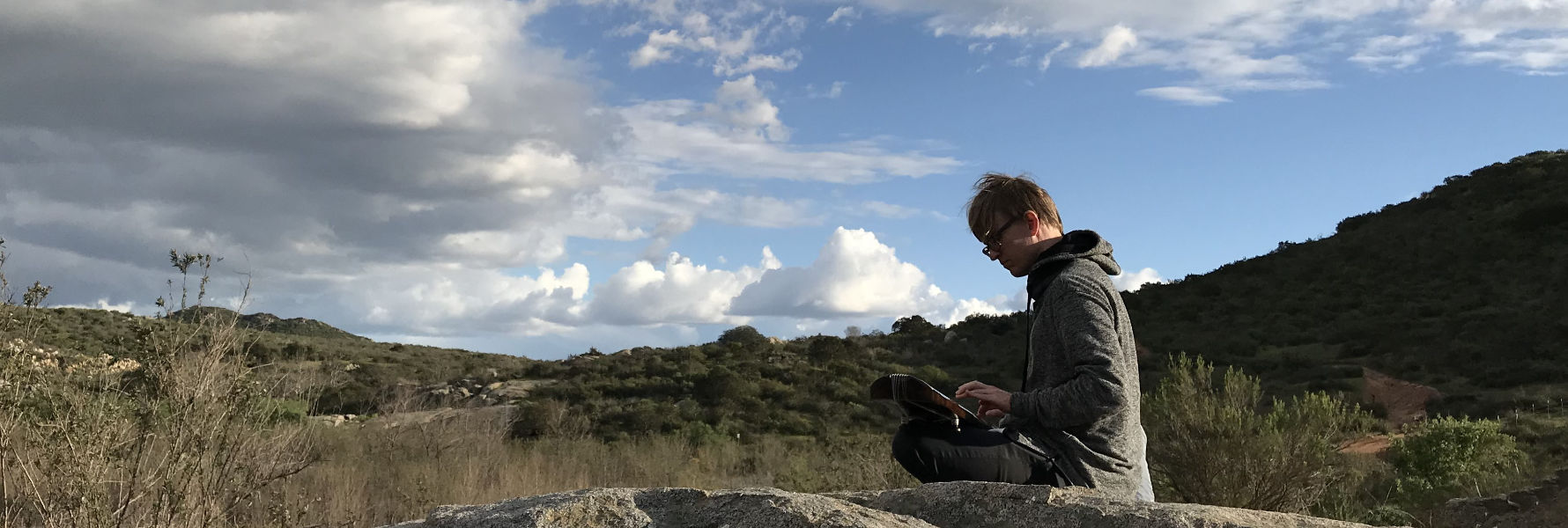 George playing guqin in nature.